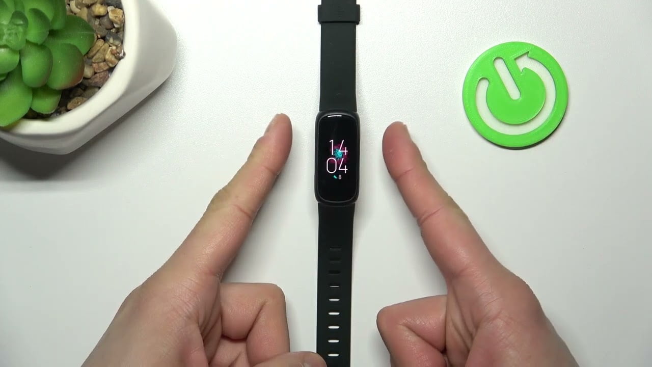 Wie starten Sie die Fitbit